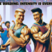 A realistic yet Pixar-style widescreen image featuring two attractive bodybuilders engaging in a friendly competition, striking double biceps poses with big smiles, showcasing their strong and well-developed muscles. The scene captures the spirit of challenge and camaraderie, with the bodybuilders focused on demonstrating who has the stronger and more developed muscles. In the background, a mixed group of fitness enthusiasts (both men and women) are cheering them on, creating an atmosphere of encouragement and sporting enthusiasm in a well-equipped gym setting. https://www.personaltrainerifbb.com/